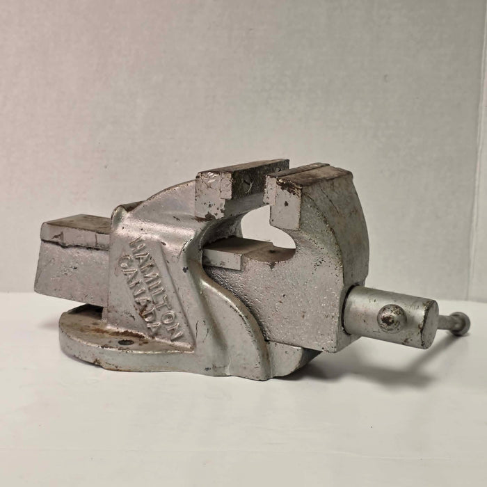 Heavy-duty antique RAE bench vise from Hamilton, Canada with 3.5-inch jaws and industrial steel construction.