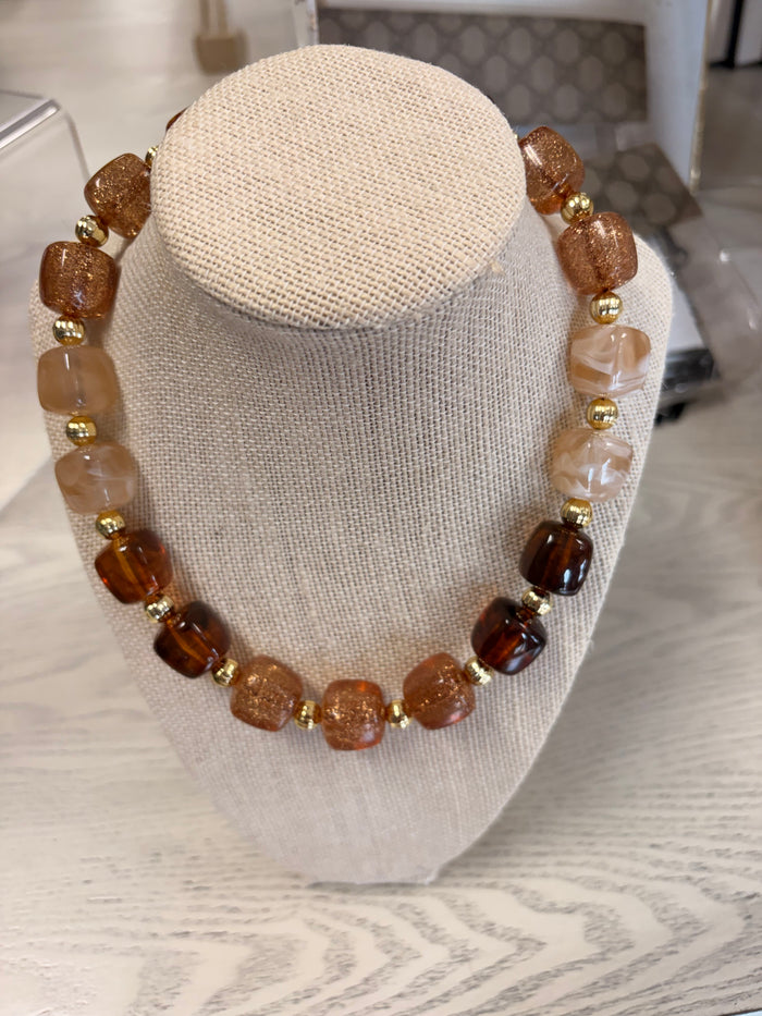 brown beaded necklace with gold flakes