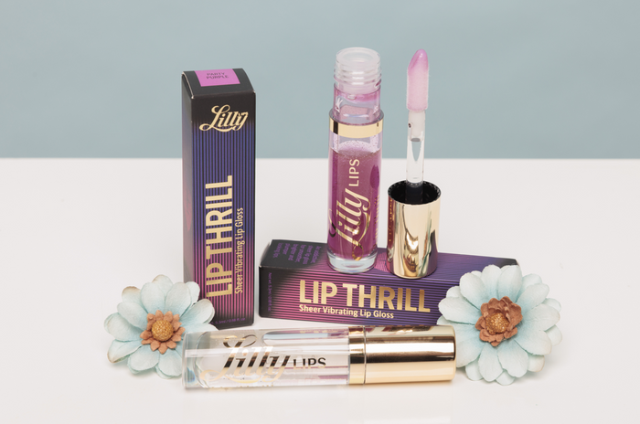 Lilly Lids lip gloss set with packaging on a light gray background