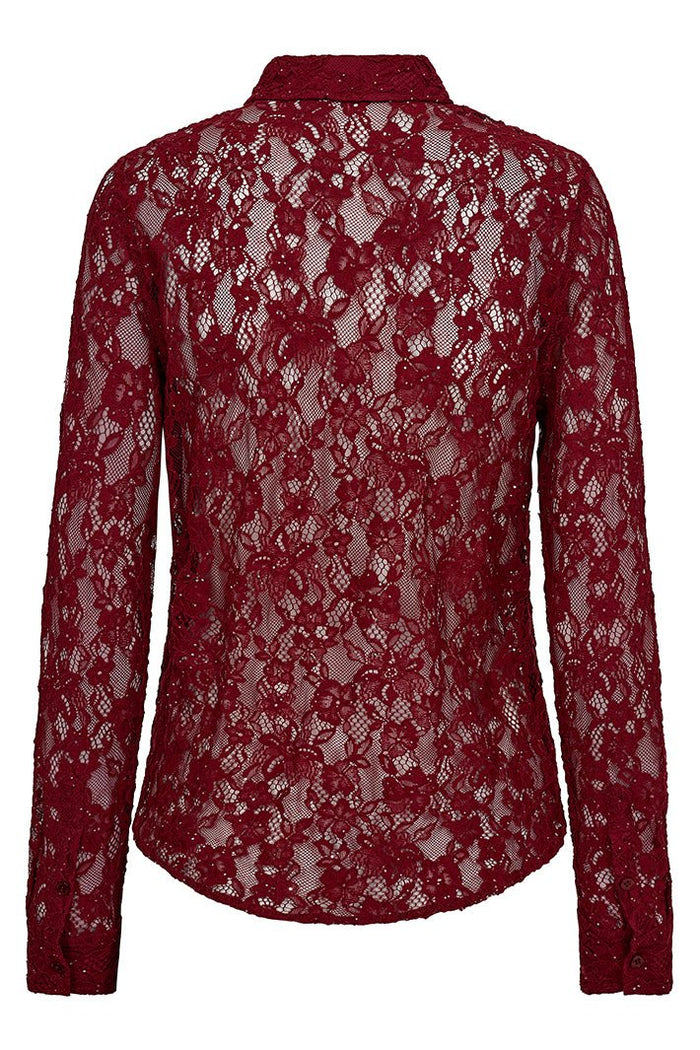 Red lace blouse on a white background