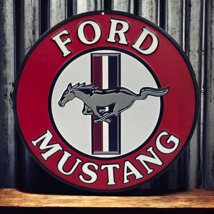 Ford Mustang logo on a round sign with a wooden surface and metal wall background