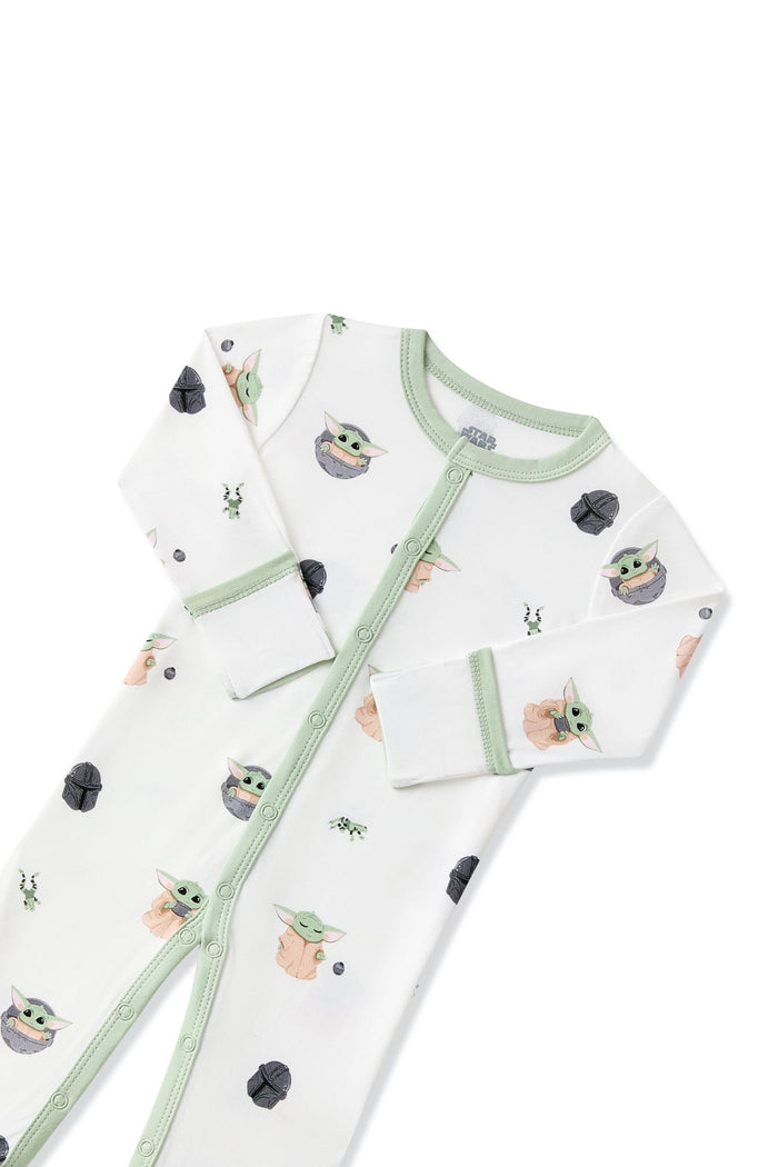 Close up of the button closure and fold over hand cuffs on the Romper in Grogu™