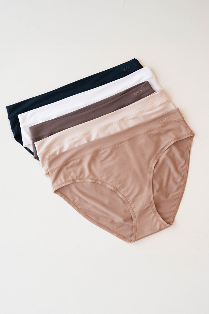 Flat lay of Women's Midi Brief in neutral colors