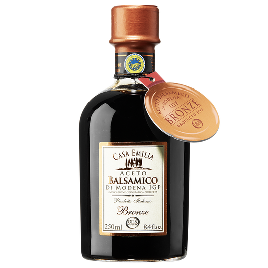 A bottle of Aceto Balsamico di Modena IGP Bronze with a copper cap and a label indicating the product is 250ml in size.