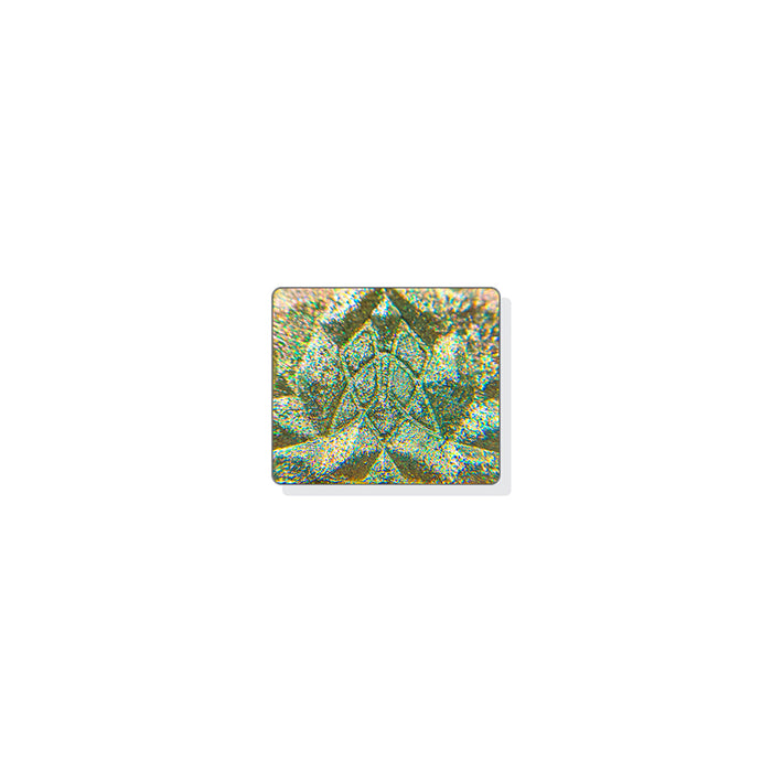 A single multichrome eyeshadow in colour Alloy on a white background. A multidimensional shadow with a soft taupe base intermixed with green, silver and red medium/large sized particles and a subtle aqua shift.