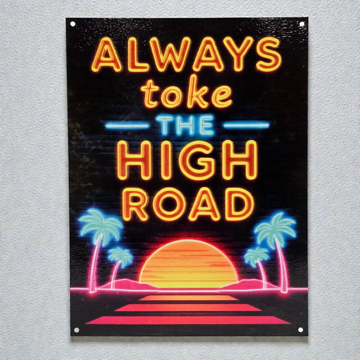 Neon-style sign with 'Always toke the high road' text on a black background