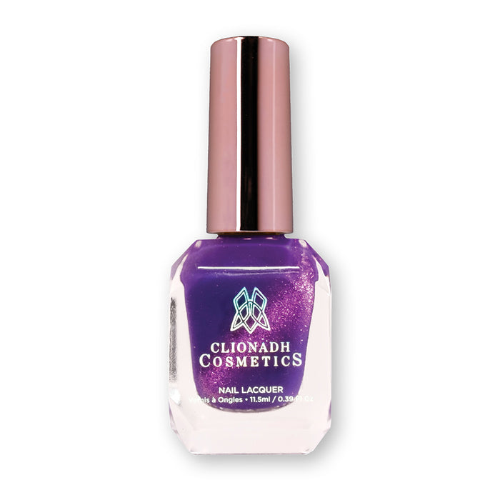 Bottle of nail polish containing Anthocyanin Nail Lacquer on white background.