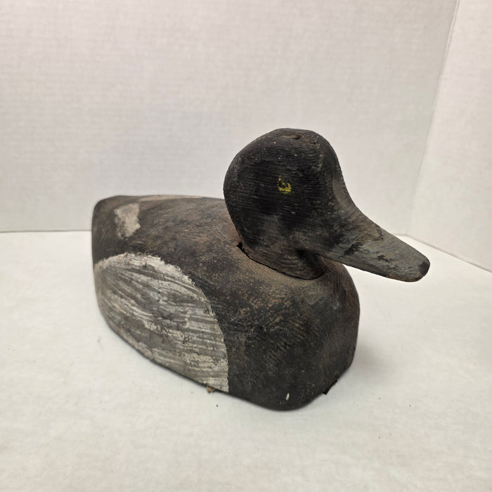 Wooden duck decoy on a white background