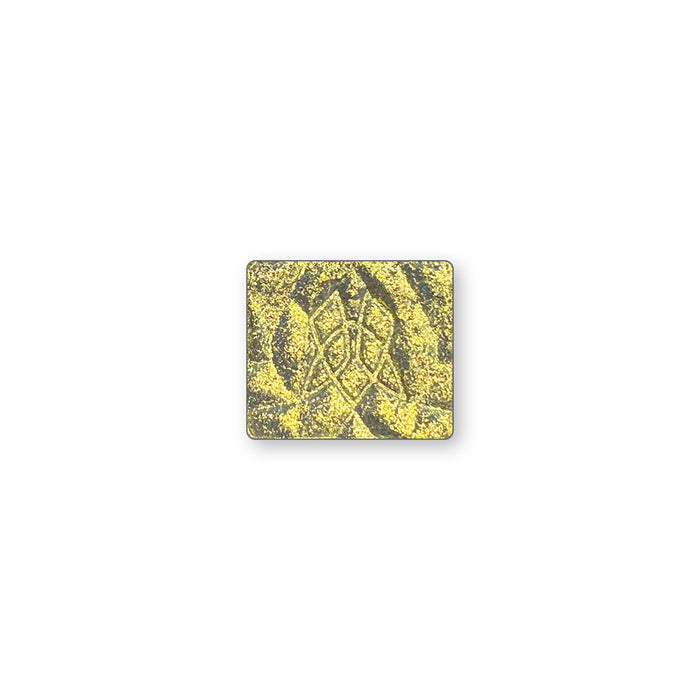 A single multichrome eyeshadow in colour Aureate on a white background. Intense yellow gold with a light grey base.