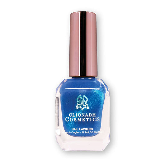 Bottle of nail polish containing Azurite Nail Lacquer on white background.