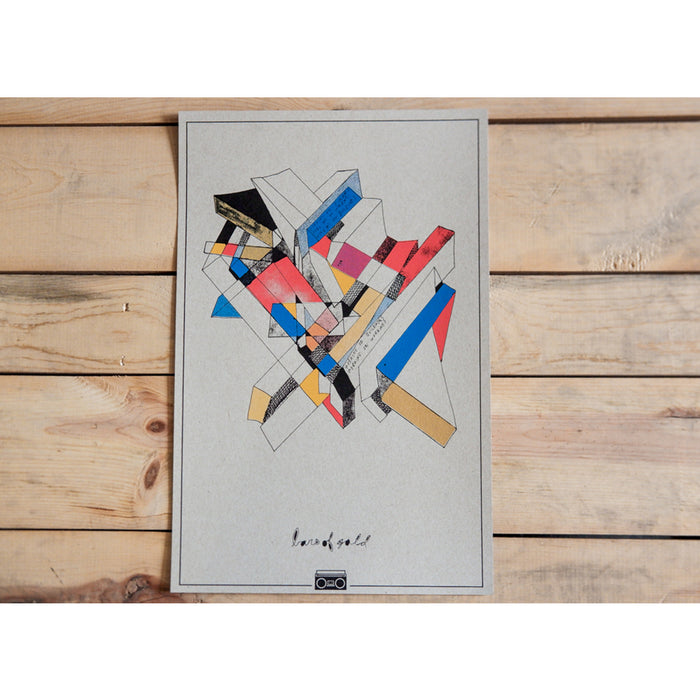 Abstract geometric artwork by Bars Of Gold features intersecting red, blue, black, yellow, and beige shapes on gray, set on a light wood surface. Gold Wall Art accents and handwritten text with a cassette tape drawing appear at the bottom.