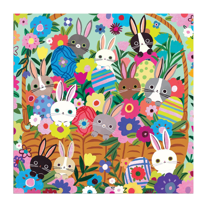 A vibrant illustration inspired by Tara Lilly's Blooming Bunnies 500 Piece Foil Family Puzzle, featuring cute bunnies with different fur colors in and around a large wicker basket amidst bright flowers and decorated Easter eggs.