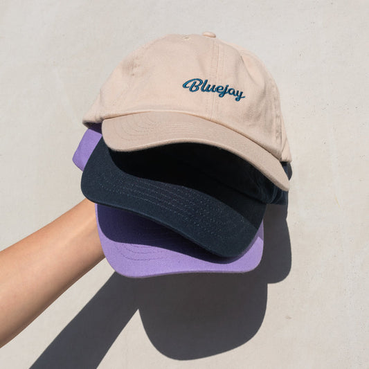 Stack of Bluejay e-bikes baseball caps