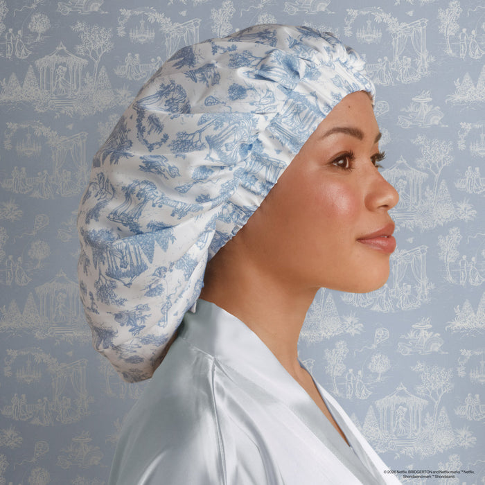 Model wearing Bridgerton x Kitsch Breathable Satin Bonnet in Garden Toile — lifestyle shot — breathable satin worn while sleeping
