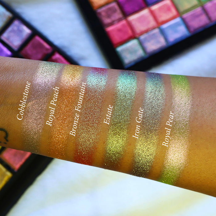 Straight angle arm swatches on medium skin tone of Bronze Fountain Earth Vibrant Multichrome Eyeshadow shifts compared to Cobblestone, Royal Peach, Estate, Iron Gate and Royal Pear