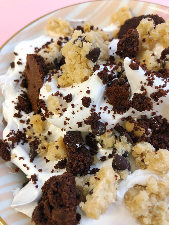 A close up shot showing just how much brownie and cookie dough is in the pint
