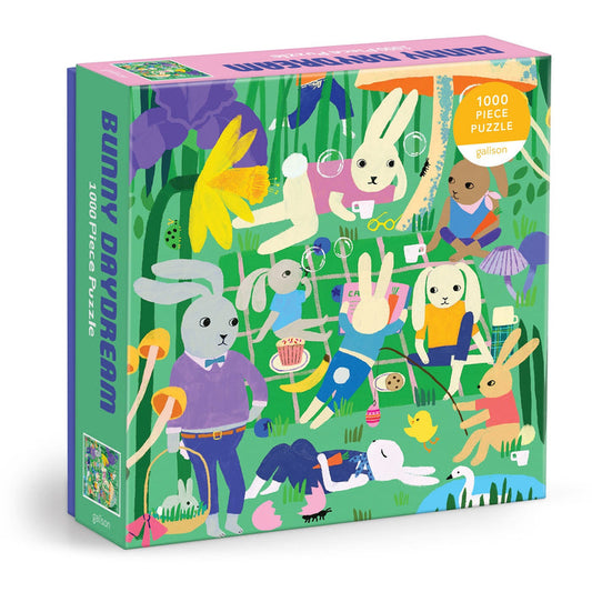 The Anne Bentley Bunny Daydream 1000 Piece Puzzle features illustrated bunnies playing and relaxing in a whimsical garden filled with flowers, balloons, and bubbles.