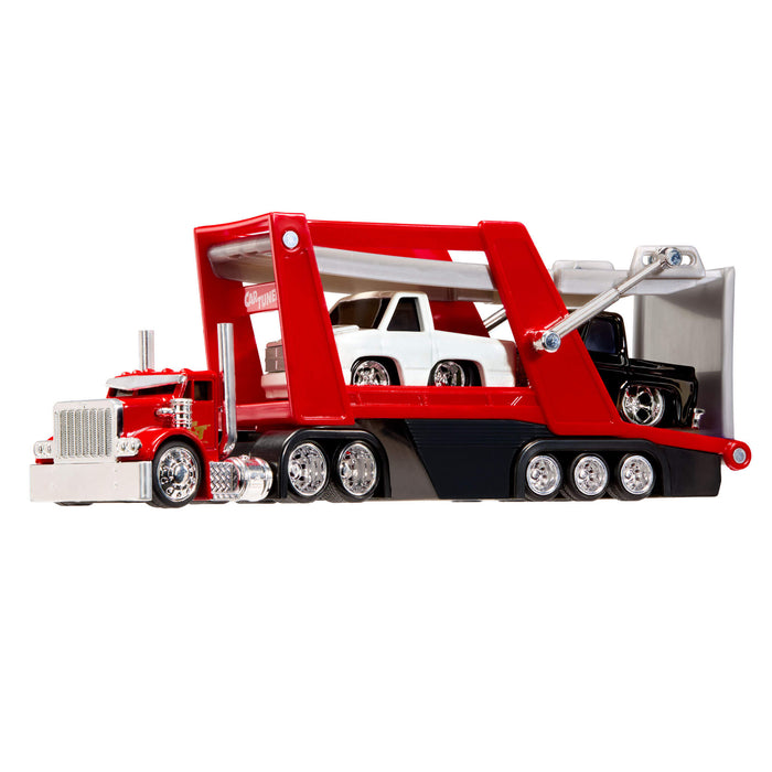 Red toy tow truck with a white truck and a black truck on a white background