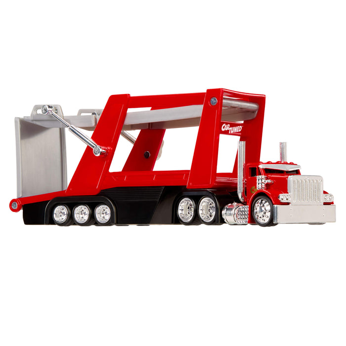 Red toy truck with a large trailer on a white background