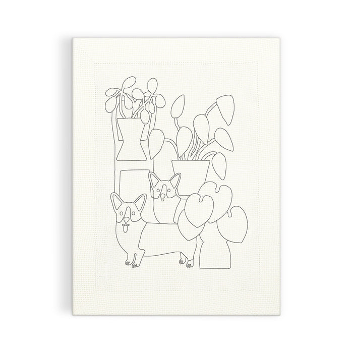 Create your own minimalist art with the Corgi Friends Punch Needle Kit by Anne Bentley, featuring two corgis among leafy potted plants on a textured white canvas.