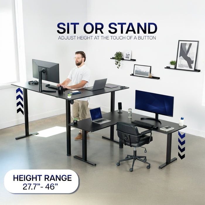 Height-adjustable desk with a man working at a modern office setup.