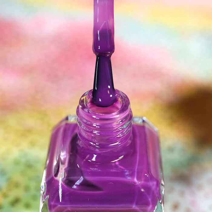 Close-up of opened nail polish bottle containing Euphoric Nail Lacquer, with brush showing.
