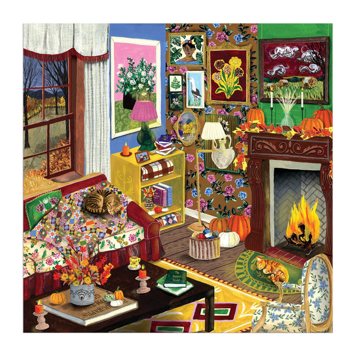 Step into autumn with the "Fall is in the Air 500 Piece Puzzle" by Abby Jacobs, featuring a cozy living room adorned with floral decor, a warm fireplace, pumpkins, a sleeping cat on the sofa, stacks of books, vibrant flowers, and art-filled walls. Through the window, a fall scene with bare trees completes this inviting autumn atmosphere—perfect for puzzling enthusiasts who love cozy seasonal settings.