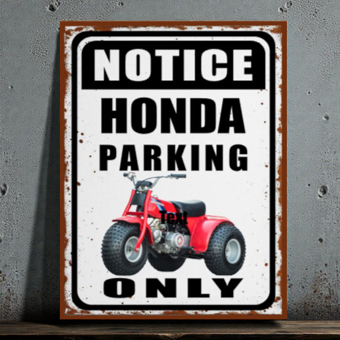 Metal sign with red ATV graphic and text 'Notice Honda Parking Only' on a textured wall background