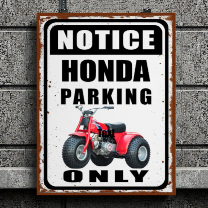 Metal sign with red ATV graphic and text 'Notice Honda Parking Only' on a textured wall background