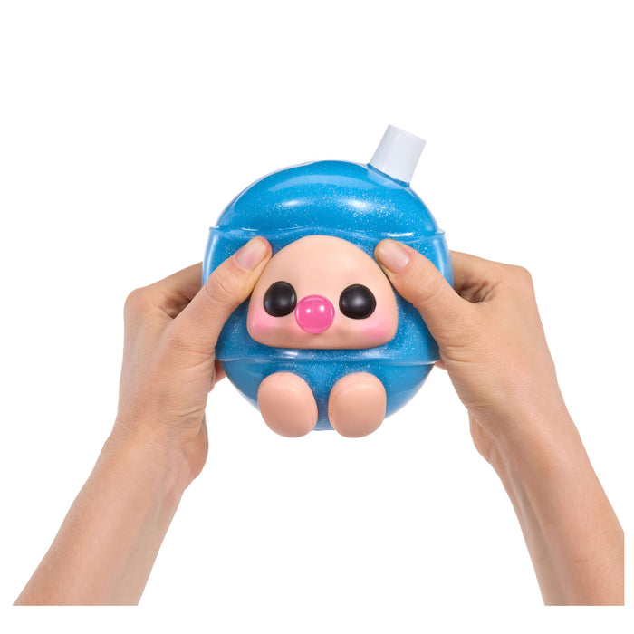 Blue squishy toy blowing a bubble held by two hands on a white background