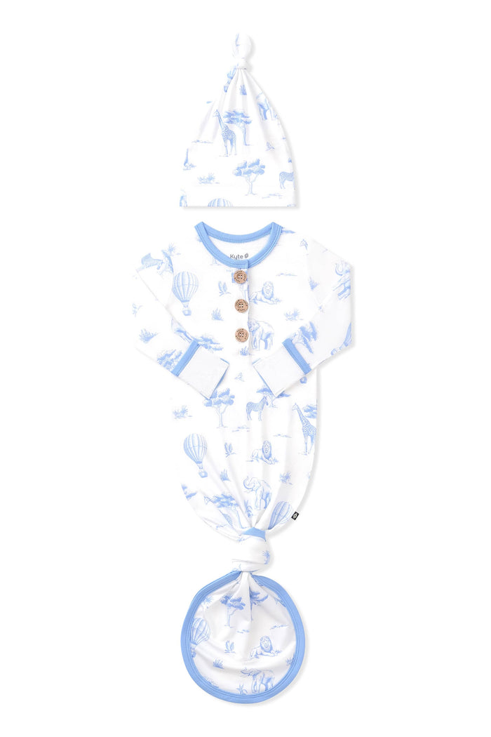 Knotted Gown with Hat Set in Toile Safari shown with the arms folded inwards on a white surface