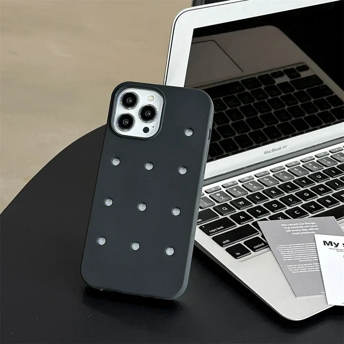Black phone case with white dots.
