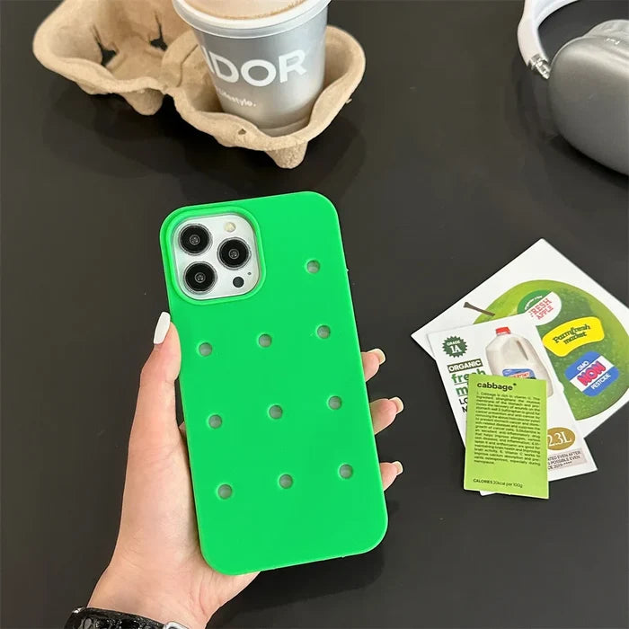 Green iPhone case with holes.