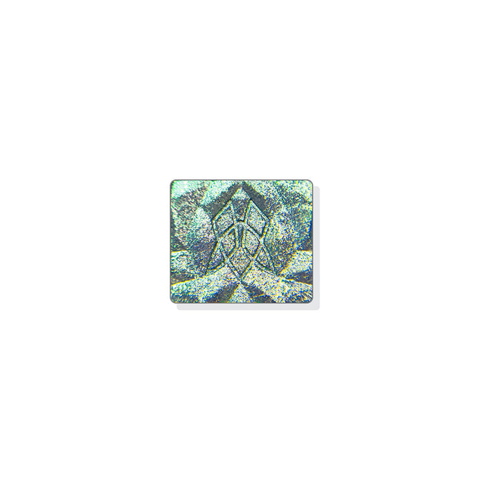 A single multichrome eyeshadow in colour Masonry on a white background. A medium taupe grey base with small particles that shift platinum-lime-aqua, with a touch of warmth.