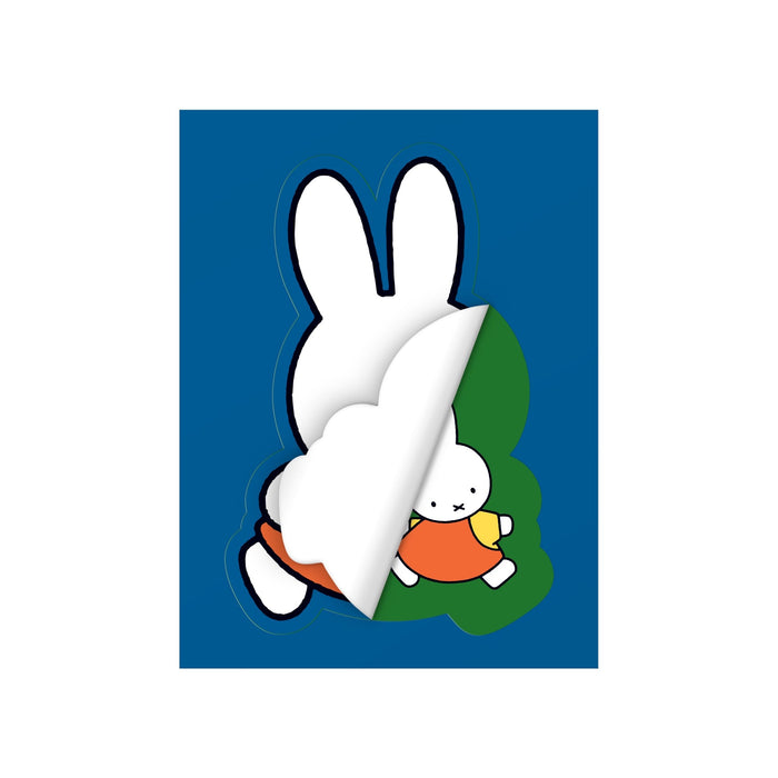 An illustration from the Miffy Postcard Sticker Book by Miffy shows a white cartoon bunny in an orange outfit peeling back a page to reveal a smaller version of itself, set against a blue background.