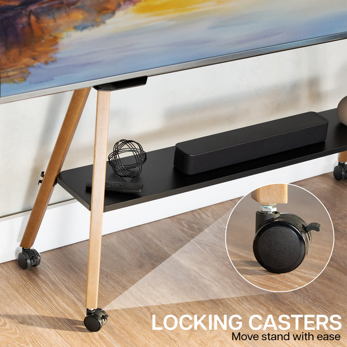 A TV stand with a black shelf, light wood legs, and black locking casters, shown in a room setting with a TV and accessories on the shelf. A circular inset highlights the locking caster mechanism.