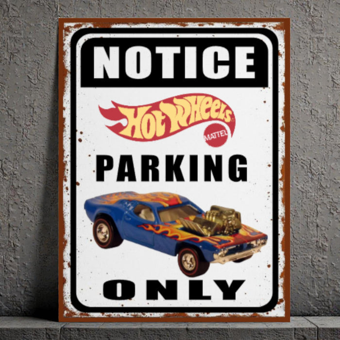Vintage-style 'Notice Hot Wheels Parking Only' sign with a classic car illustration on a gray wall.