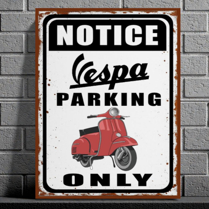 Vintage-style sign with Vespa scooter graphic and 'Notice Vespa Parking Only' text on a brick wall background.