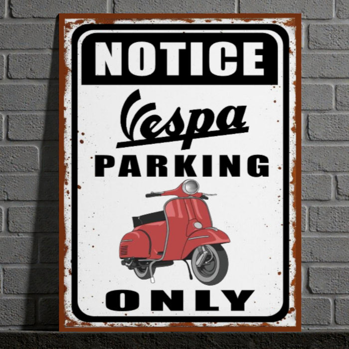 Vintage-style metal sign with Vespa scooter graphic and 'Notice Vespa Parking Only' text on a brick wall background.