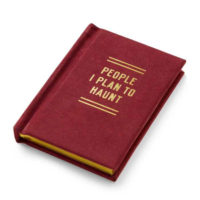 The Brass Monkey People I Plan To Haunt Tiny Diary is a pocket-sized journal with a maroon cover and gold lettering, shown closed on a white background.