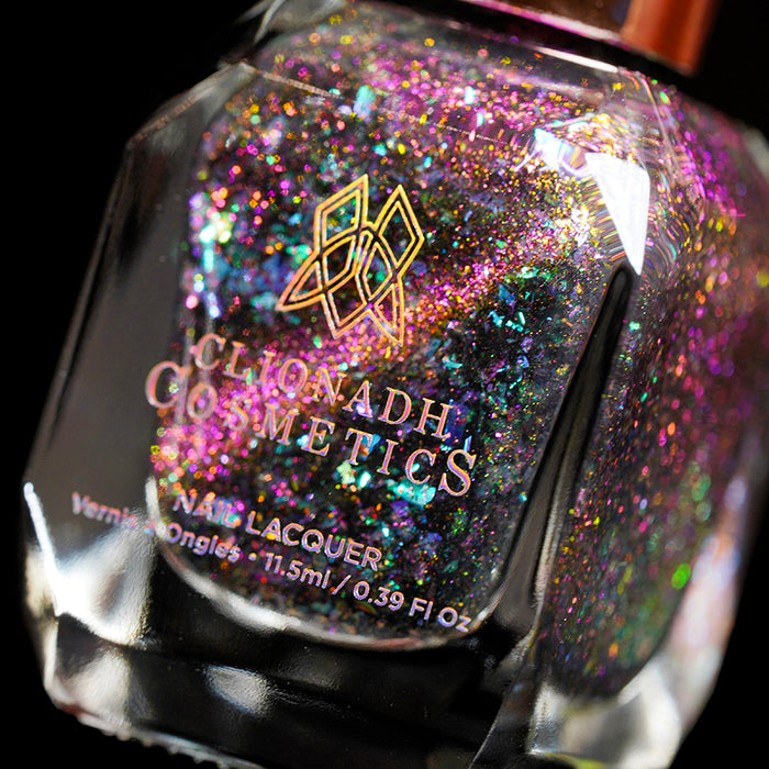 Angled, close-up of nail polish bottle containing Pholiotina Nail Lacquer, on a black background.