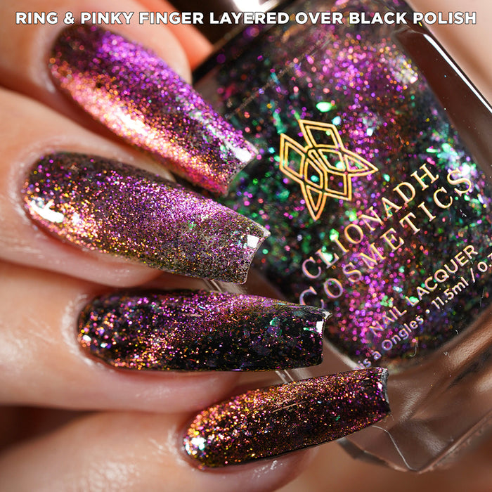 Close-up of nails painted with Pholiotina Nail Lacquer on fair skin tone. Hand is holding polish bottle.