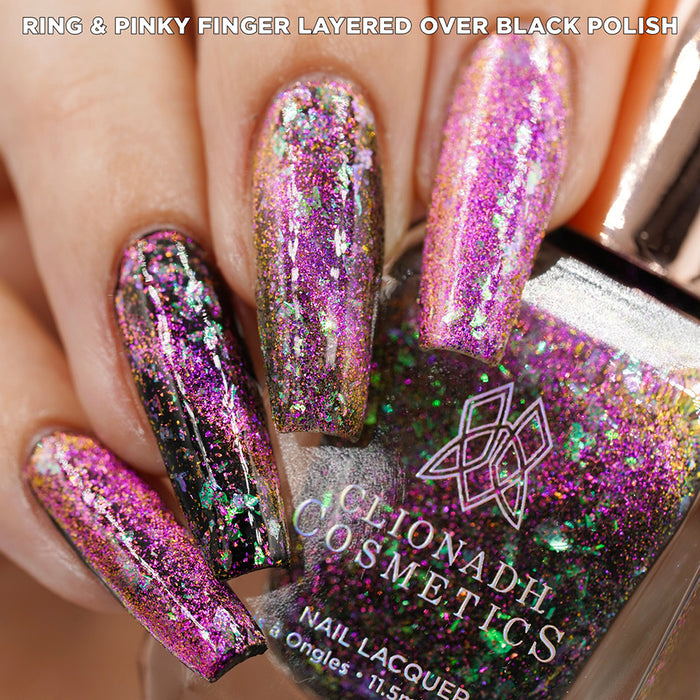 Close-up of nails painted with Pholiotina Nail Lacquer on fair skin tone. Hand is holding polish bottle.