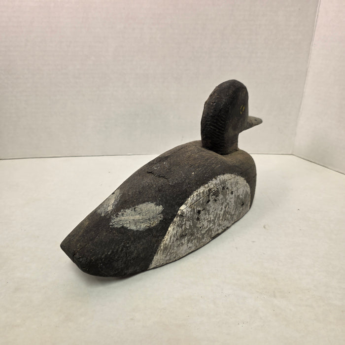 Wooden duck decoy on a white background