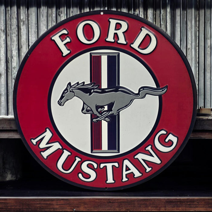 Ford Mustang logo on a round sign with a red border and white background.