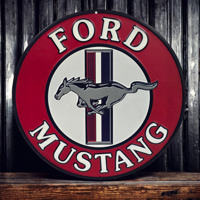 Ford Mustang logo on a round sign with a wooden background