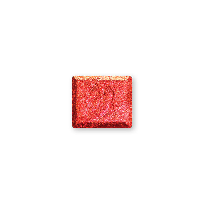 A single multichrome eyeshadow in colour Ring of Fire on a white background. A large particle glitter shadow with red sparkles that shift red-orange-peach-yellow.