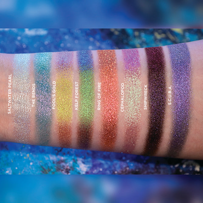 Arm swatches on fair skin tone of all eight eyeshadows included in the Deep Sea Treasures Palette.