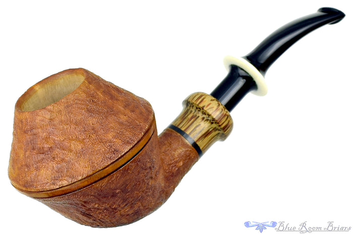 Blue Room Briars is proud to present this Ron Powell Pipe 1/8 Bent Sandblast Rhodesian Sitter with Red Palm Ferrule and Ivorite Stem Insert