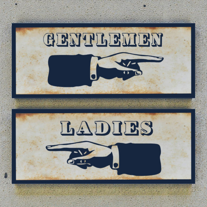 Two vintage-style restroom signs with hand illustrations on a textured wall background.